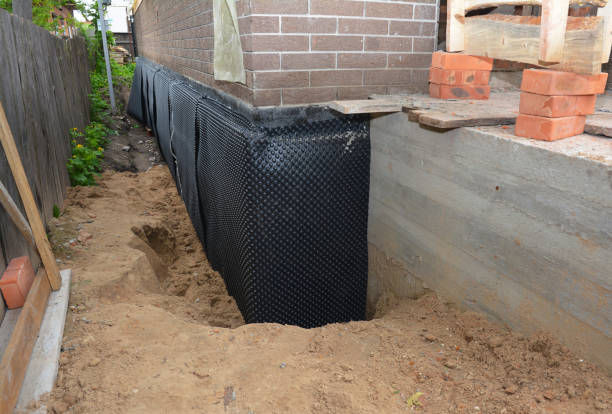 SJ Waterproofing Pros technician performing targeted Wet Basement Repair assessment in Crestline, OH